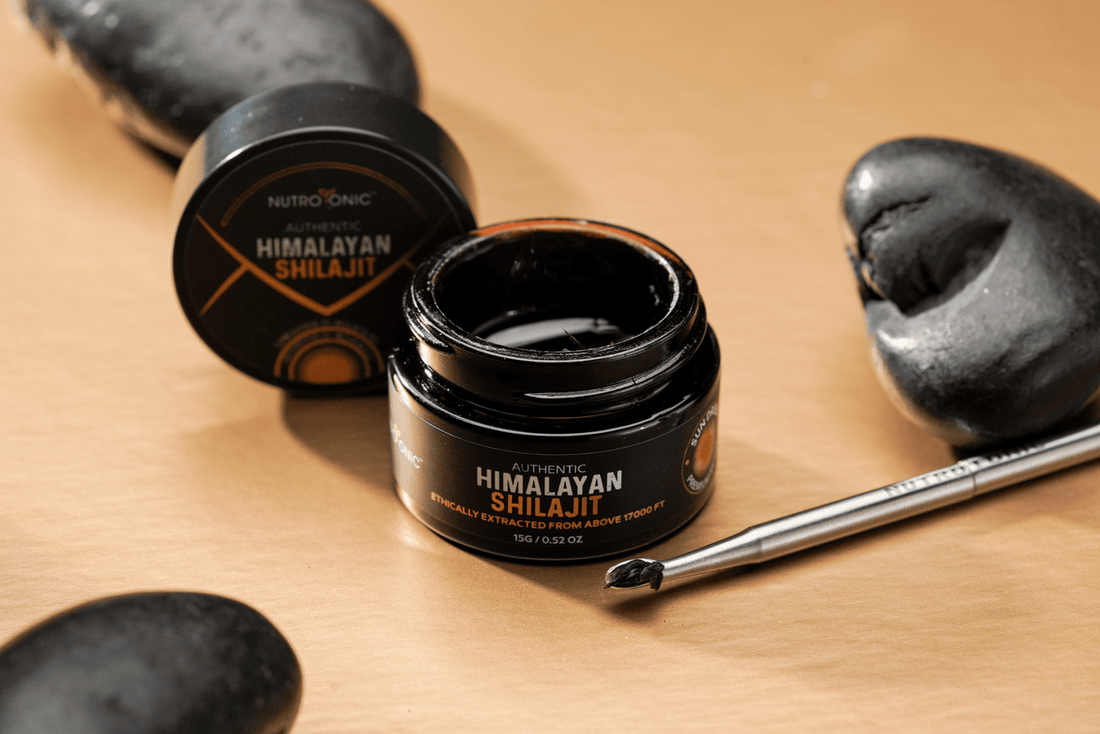 Close-up of NutroTonic’s Himalayan Shilajit resin being scooped with a small tool.